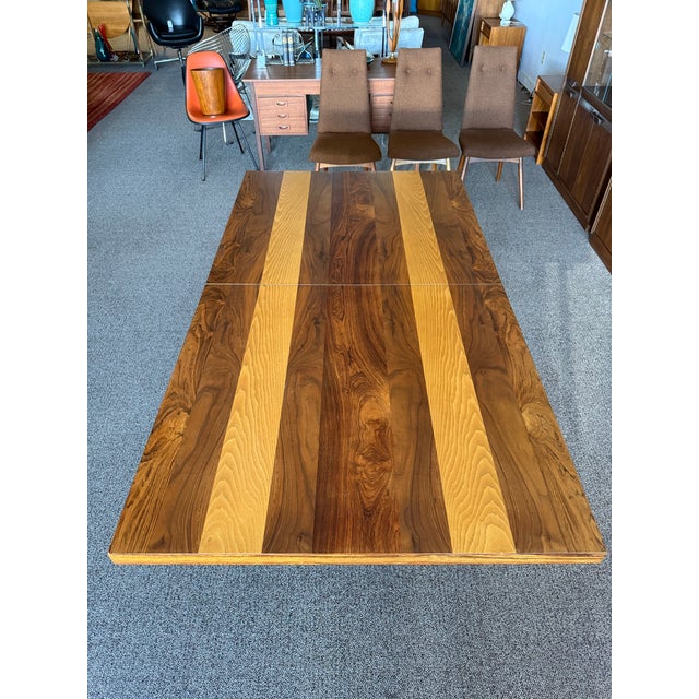 Here’s an incredible MCM dining table designed by Milo Baughman for Directional’s “Gallery One” line. Gorgeous mixed woods...