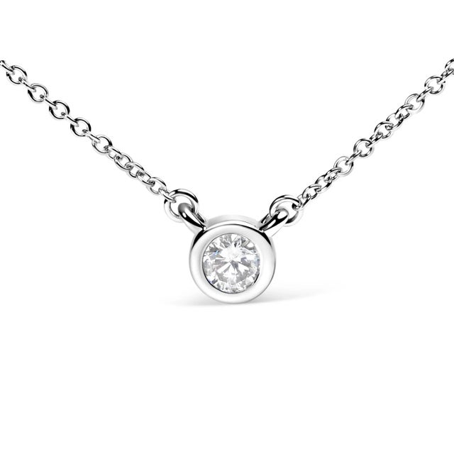 Embrace simplicity with a touch of timeless elegance with this exquisite pendant necklace, masterfully wrought from 10K...