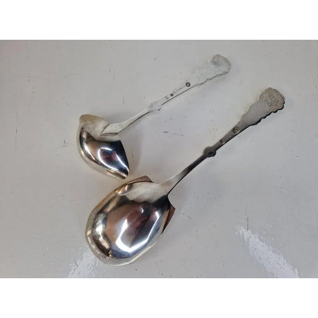 Very nice set from the time of Art Deco. A large serving spoon and a saucepan. Richly decorated ornamentation of the...