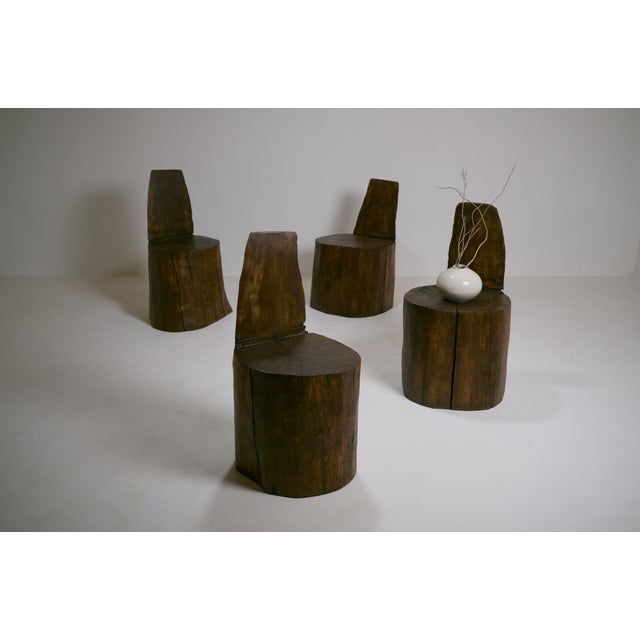 Set of four Brutalist monoxylous armchairs in solid birch. These armchairs evoke small architectural structures or...