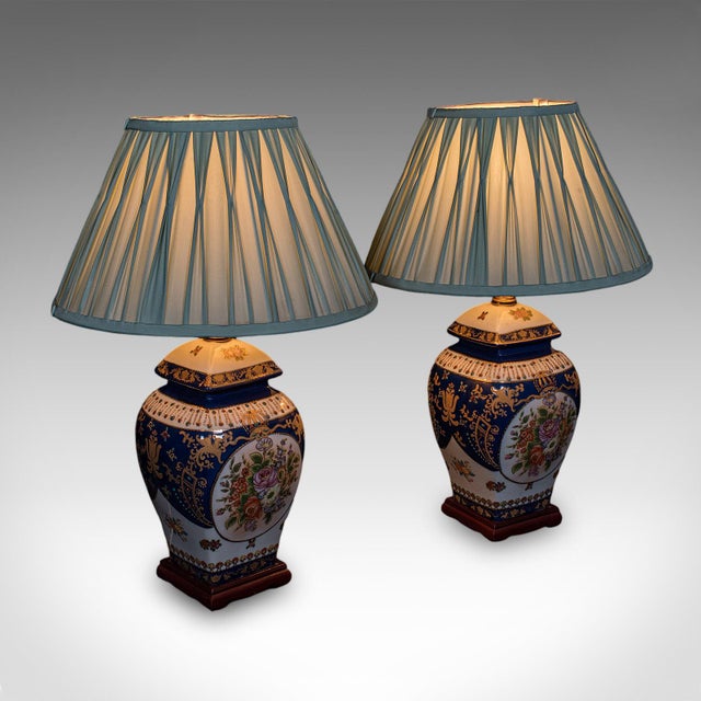 This is a pair of vintage table lamps. An Oriental, ceramic baluster form accent light with Continental revival taste,...