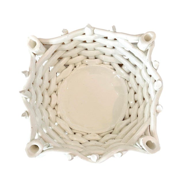 A gorgeous, vintage ceramic basket woven cachepot/ vide poche / vessel. Features a handmade, earthenware body in a...