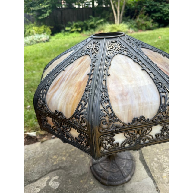 Stunning 1920s American antique stained glass lamp. Features graceful nature motifs and is a beautiful example of the Art...
