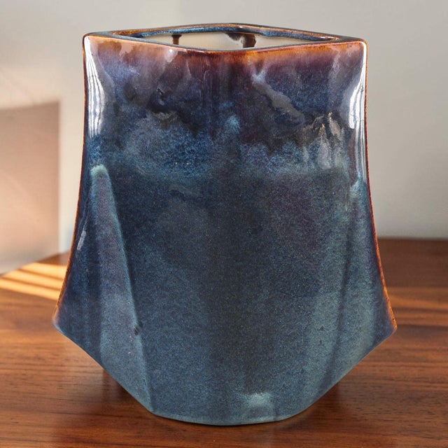 This Mid-Century Modern glazed pottery vase features an unusual form and a beautiful blue color. Made in the United...