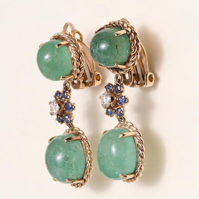 Vintage Emerald, Sapphire & Diamond Dangle Earrings 18K Gold | Circa 1970 These striking vintage dangle earrings from the...