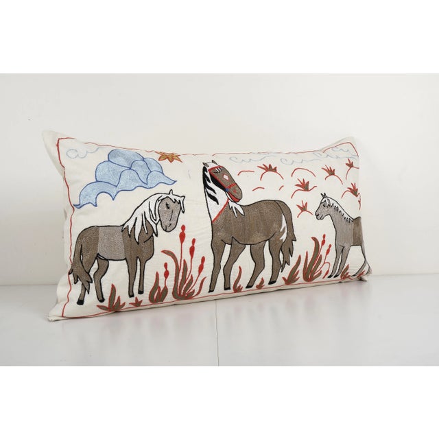 Suzani Horse Cushion Cover Suzani is an exquisite fabric, every piece is unique but can also contain small imperfections;...