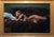 The artwork presents a serene figure reclining on a textured brown fur throw, exuding a sense of calm and intimacy. The...