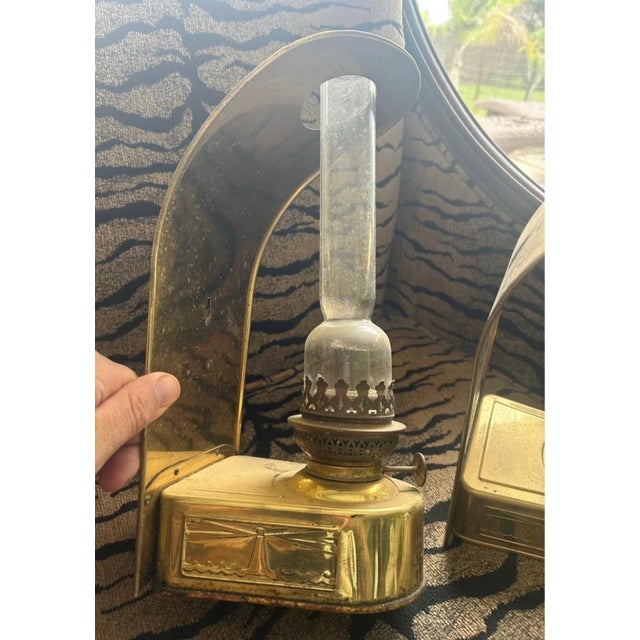 Beautiful matching pair of vintage D.H.R. Holland (Den Haan Rotterdam) brass wall-mounted oil lamps featuring an embossed...