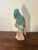 Beautiful and vibrant hand carved wooden parrot sculpture. Hand painted in bright tropical colors. Would look great in any...