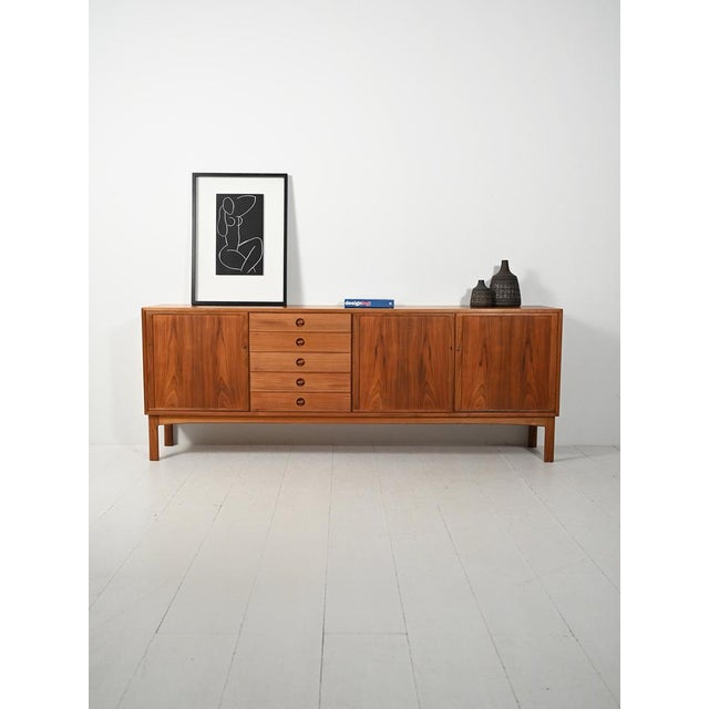 Swedish teak sideboard by Sven Engström and Gunnar Myrstrand for Skaraborgs, with doors, a central drawer, and the...