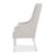 A 49-inch back frames the head of the table, giving the seat a taller and more substantial presence than the side chairs...