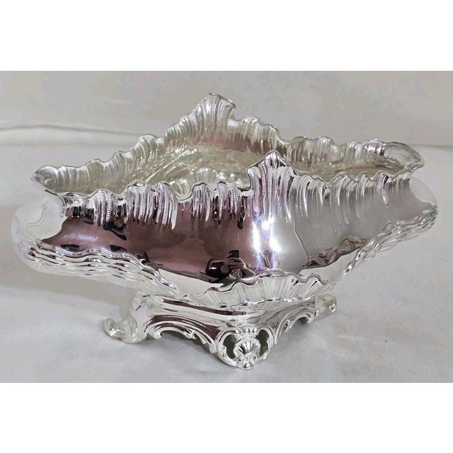 A fine Victorian sterling silver plant stand, planter or jardinière by Lawrence Emanuel, hallmarked Birmingham 1890. The...