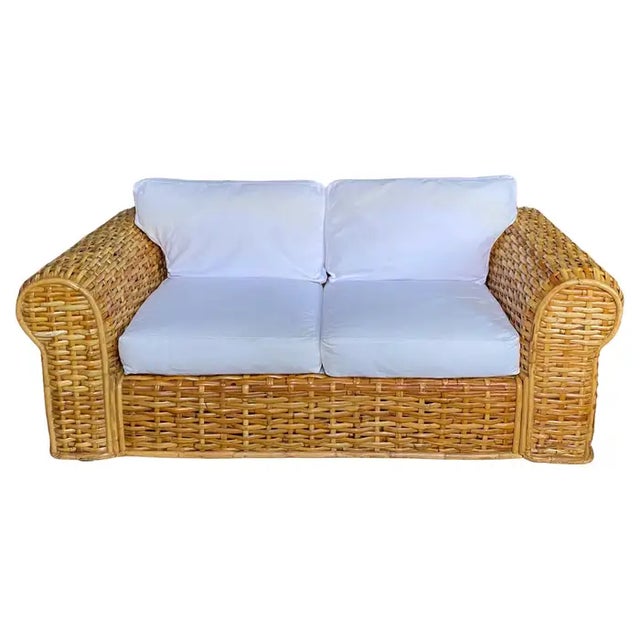 Classic Ralph Lauren Polo Home natural woven rattan and bamboo sofa, Late 20th Century. This modern sculptural loveseat...