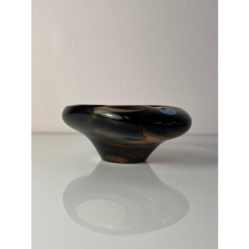 This sculptural ashtray in grey glass is a fascinating collector's item of Czechoslovakian post-war design, created by the...