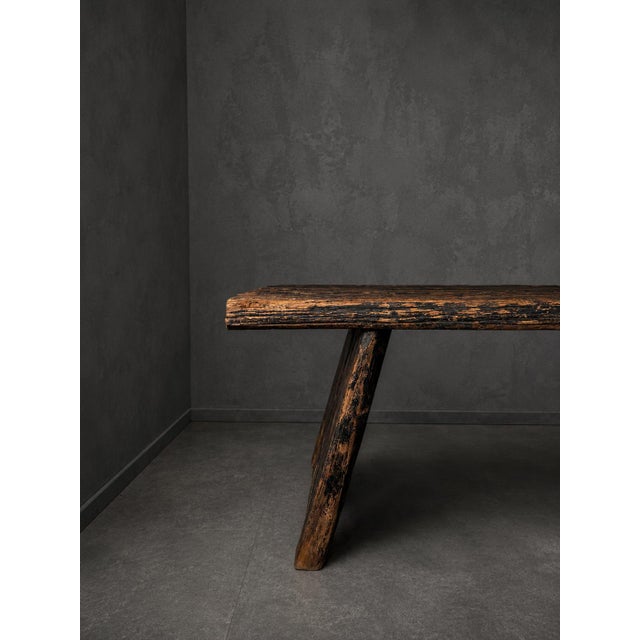 Impressive large dining table with a strong rustic and Brutalist appearance. The table features a substantial solid wooden...
