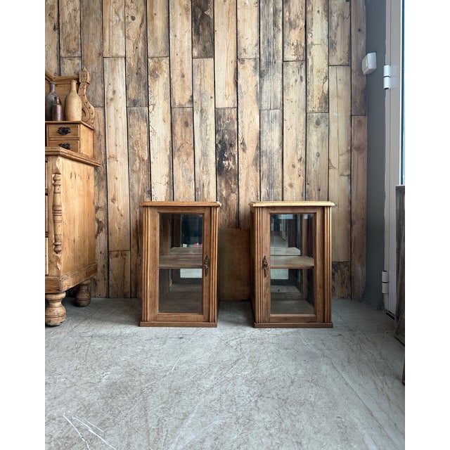 Pair of art deco display cabinets from the 1920s-1930s in solid oak, likely originally from the upper section of an...
