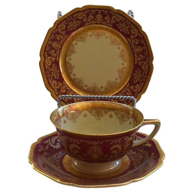 Vintage 1930s Cranberry red and Ivory tea cup and saucer set with matching desert plate encrusted with gold. This listing...