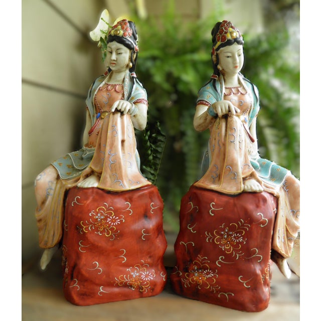 These statues are a beautifully rendered, very rare pair of mid-20th century porcelain statues depicting Quan-Yin...