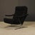 Striking mid-century modern lounge chair featuring a sculptural chrome X-base frame and deep cushioned seat with textured...