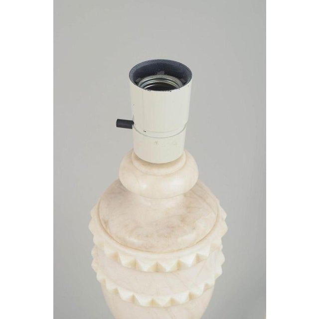 Italian Marble Table lamp, 1970s. Sculptural table lamp in light marble featuring a decorative band of small carved...