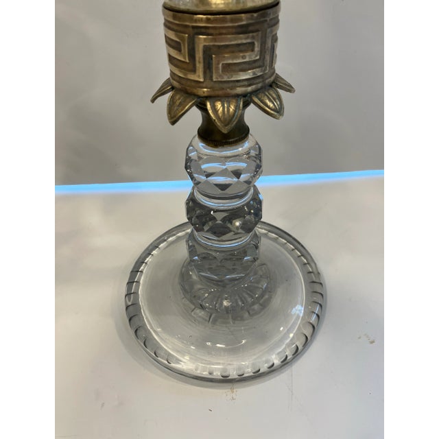 This pair of vintage hurricane lamps are made of cut glass , brass& blown glass shades The candlesticks are heavy cut...