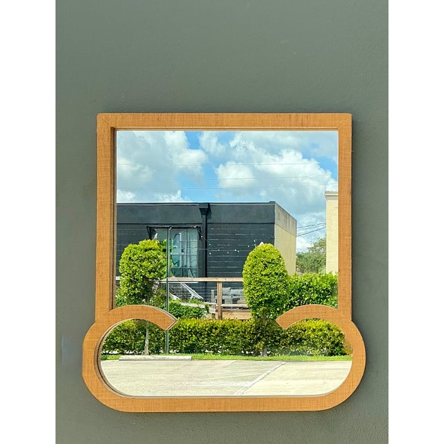 This vintage mid-century wall mirror beautifully combines natural materials with refined craftsmanship, creating a...