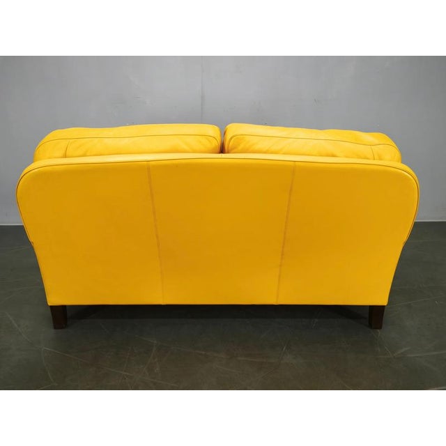 An original Poltrona Frau “George” leather sofa, manufactured in Italy in 1992, complete with the original factory labels....
