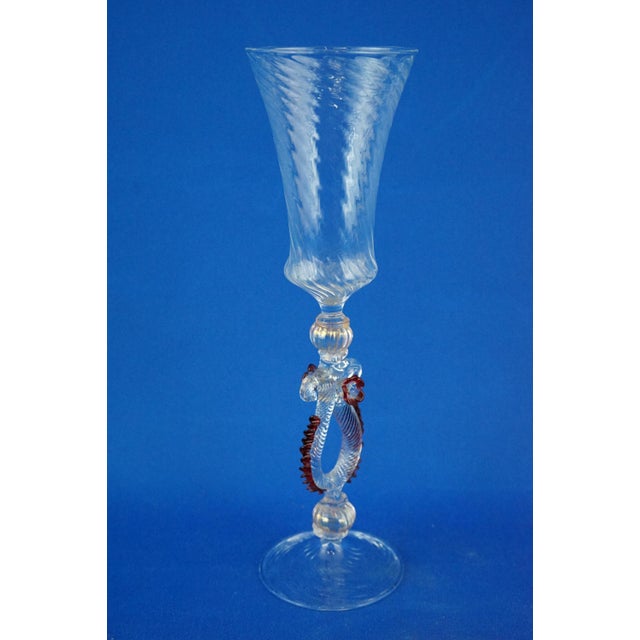Elegant goblet in the finest clear blown Murano glass, "Trionfo" model. The stem is made from a clear glass cord fluted...