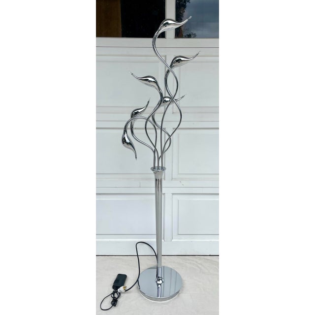 Here is a stunning, figurative floor lamp featuring sculptural swan heads in a chrome finish. There are 6 total swans and...