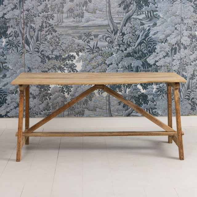 An early 19th c. Italian Pine Trestle Table from Marche, Italy. This charming table has a beautiful, natural aged patina...
