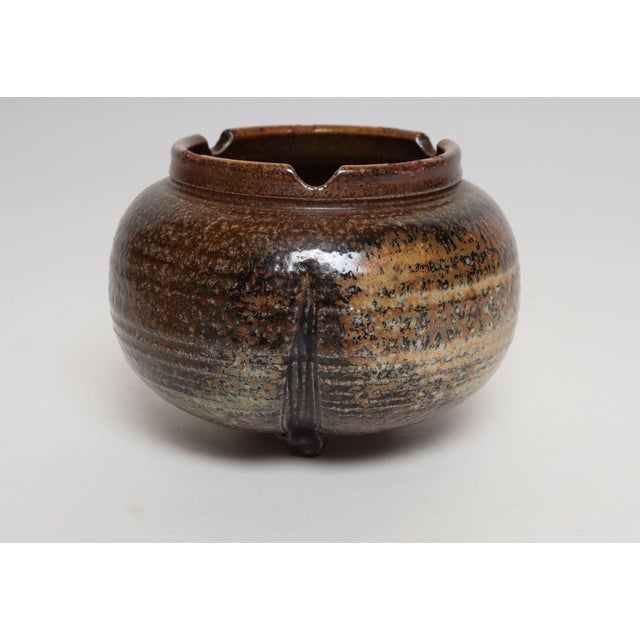 Studio ceramic footed planter with drainage hole by ceramicist, Deanna Nichols (b. 1942-2017, Missouri). Holding a BFA...
