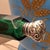 This antique Victorian double-ended perfume bottle is crafted from emerald green faceted glass and adorned with beautiful...