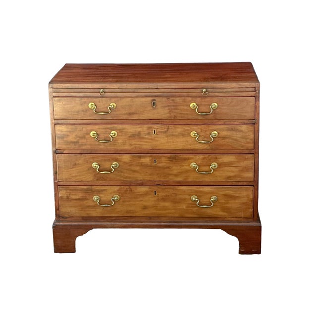 A fine English chest or dresser cabinet of patinated mahogany from the Georgian period, featuring a moulded top over a...