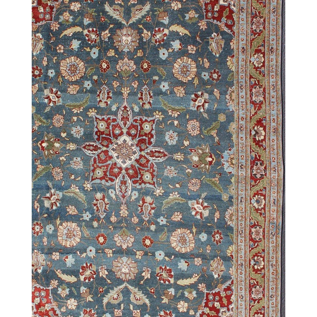 Measures: 6'10 x 9'10. Steel blue, antique Persian Tabriz rug with flowers and medallion. Keivan Woven Arts / rug 18-0702,...