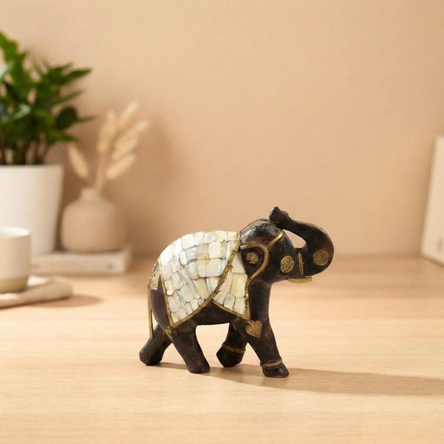 Invite the majestic spirit of the East into your home with this exquisite Hand Carved Wooden Elephant Statue. Inspired by...