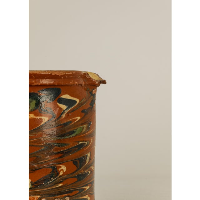 French Savoie Glazed Earthenware Pitcher with marbled polychrome slip application in black, green, cream and yellow...