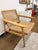 A beautifully crafted lounge chair that blends sculptural mid-century lines with the warmth of handwoven natural fiber....