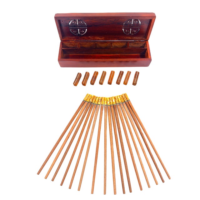 A beautiful handmade set of chopsticks finished in a warm, natural wood grain complemented by striking yellow and ivory...