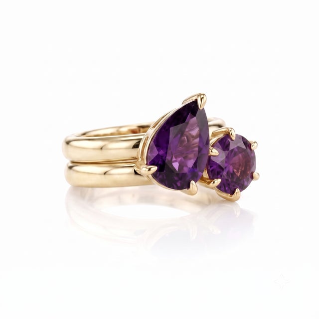 Elevate your everyday style with the velvety richness and regal charm of deep purple. This exquisite two-stone set...