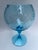 A single blue swirled blown glass footed vase or bowl.