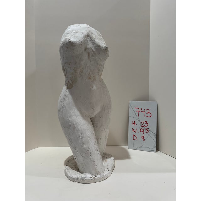 Larry Mohr (American, 1921-2013) female torso sculpture in white painted plaster with dynamic pose. This figurative work...