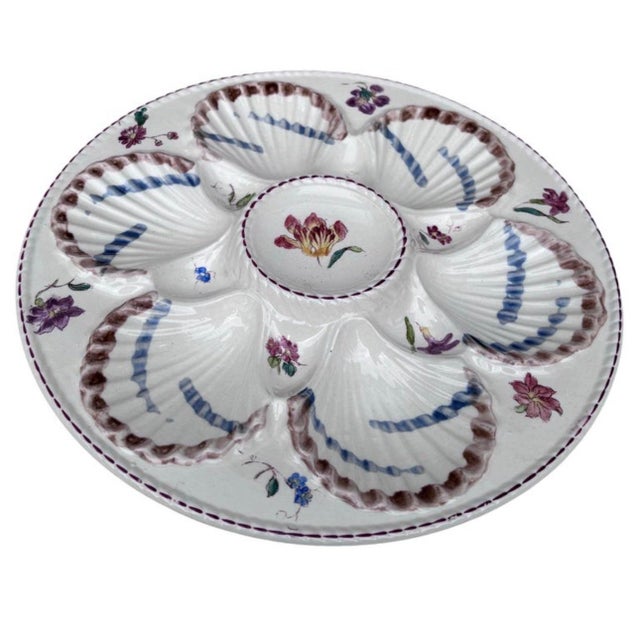 French Majolica oyster plate with flowers circa 1890 signed Longchamp.