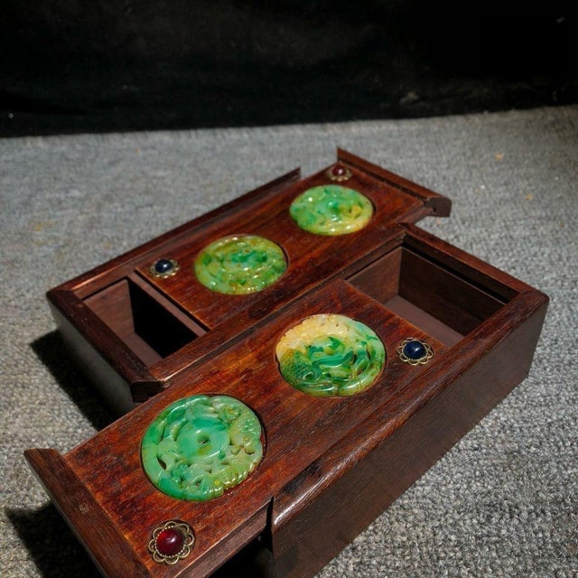 A charming and collectible vintage Chinese hardwood jewelry box, crafted from reddish-brown Huali (Rosewood). The unique...
