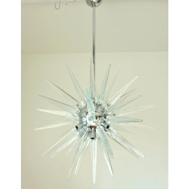 Italian modern Sputnik chandelier with clear Murano glass shards spikes, mounted on chrome metal frame, designed by Fabio...