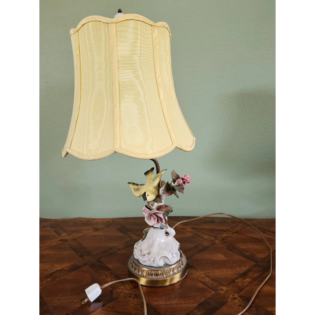 An adorable Victorian table lamp that will delight vintage lovers. Hand-painted porcelain with cute details such as a...