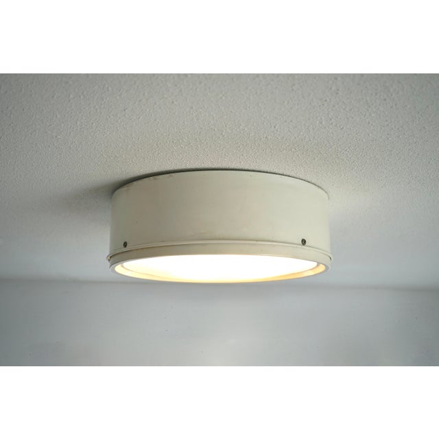 A circular lamp that can be used as ceiling lamp or wall lamp. This is the largest sized version manufactured and is rare...