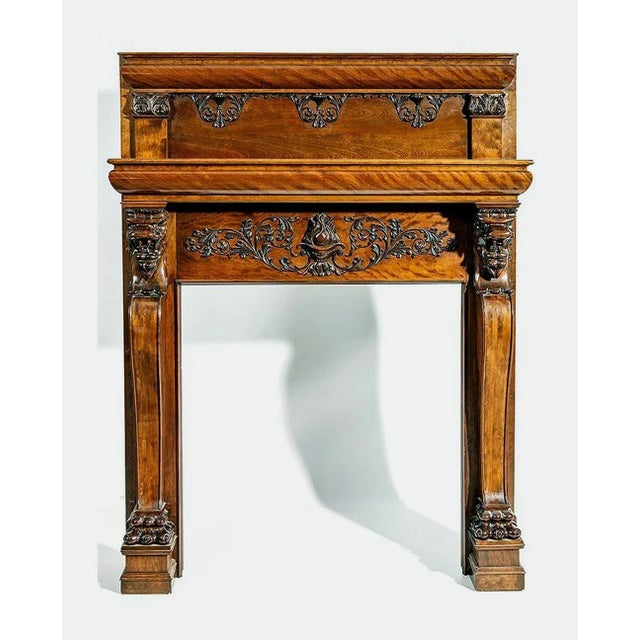A large and impressive mahogany fireplace mantel with amazing carvings, of American origin, circa late 19th century to...