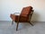 Vintage 1950s Mid Century Modern Danish lounge chair crafted with a beautifully sculpted solid wood frame and elegant...