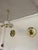 Set of 2 gold-colored discus lamps. These lamps were purchased by Charlotte Perriand for Les Arc’s Resort in the 1970s....