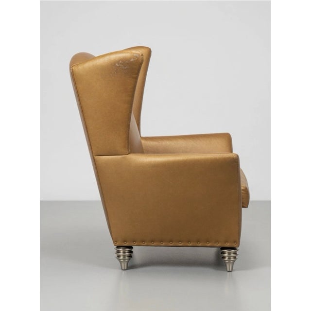 The Space Age Gold Wingback Chair by Larry Laslo for Directional is a luxurious accent chair perfect for adult spaces....